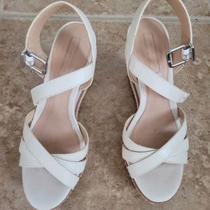 Wedge sandals. White to cream color.